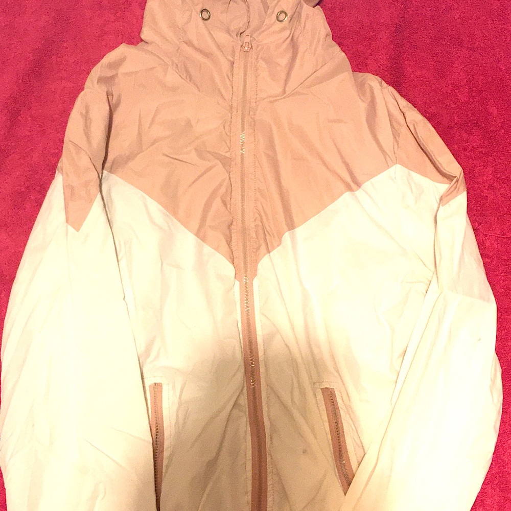 Pink and white windbreaker.